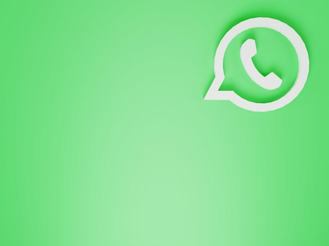 a green wall with a white phone on it