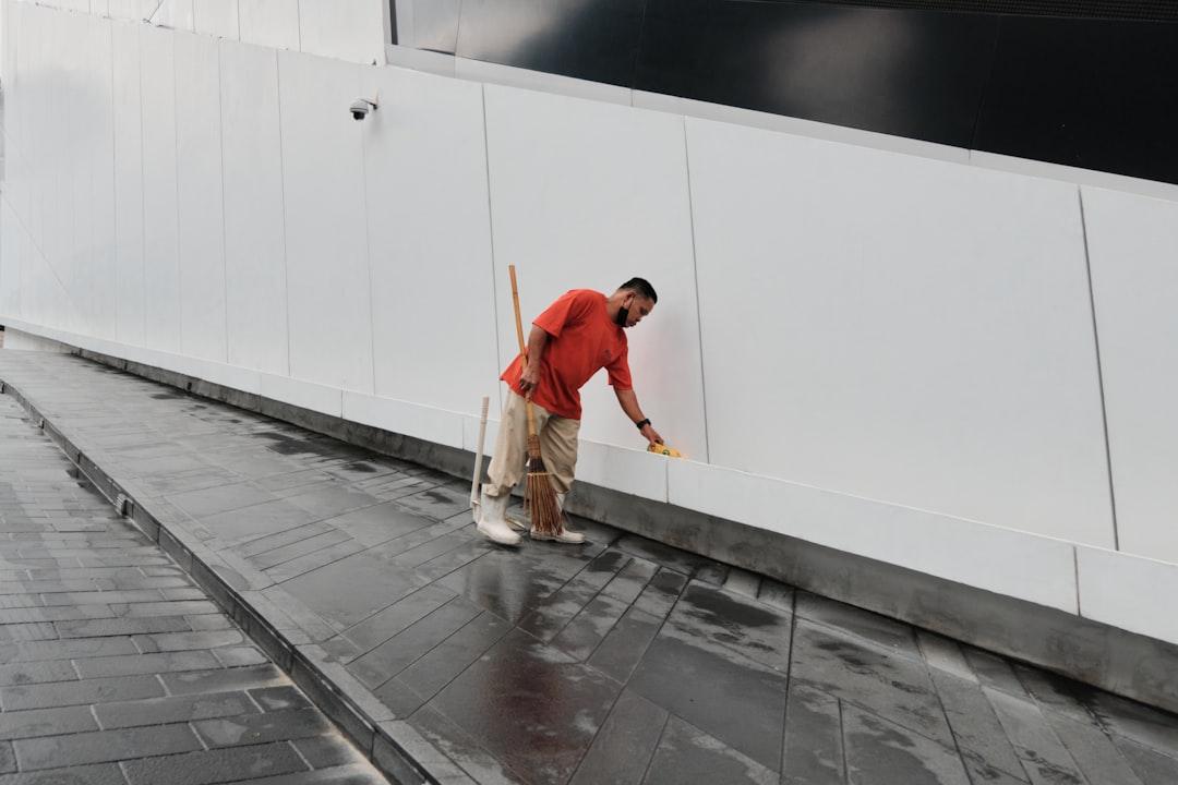 a man walking on a sidewalk