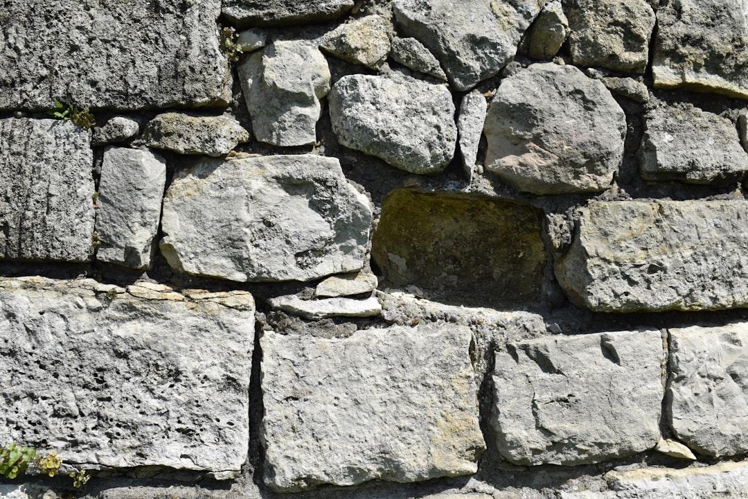 a close up of a stone wall made of rocks