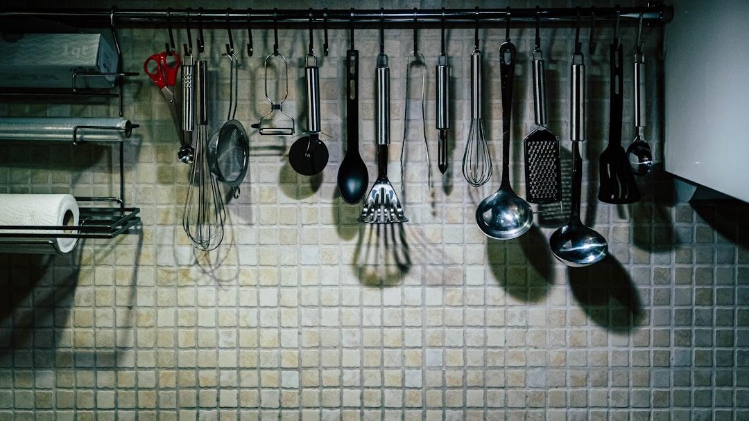 a rack full of kitchen utensils