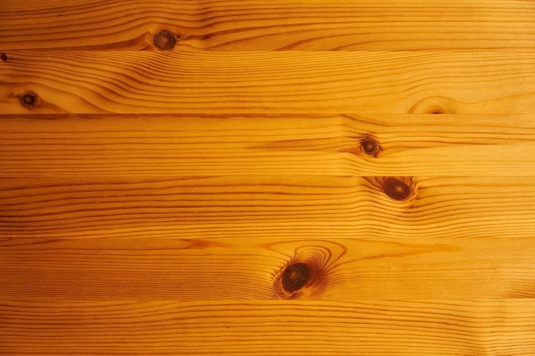 a close up of a wooden surface with knots