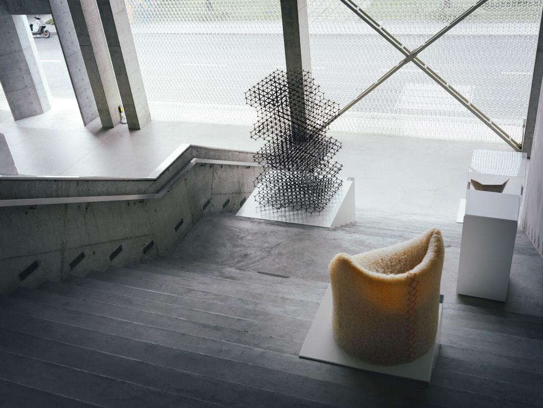 A chair sitting on top of a wooden floor next to a window