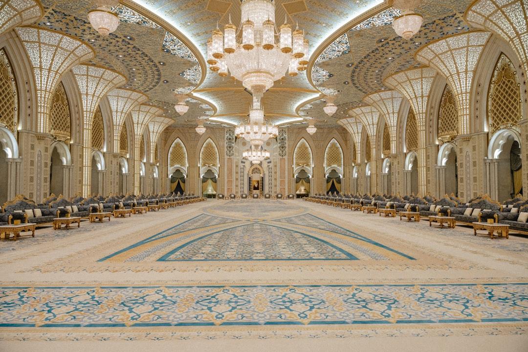 a large room with a large chandelier and a large pool
