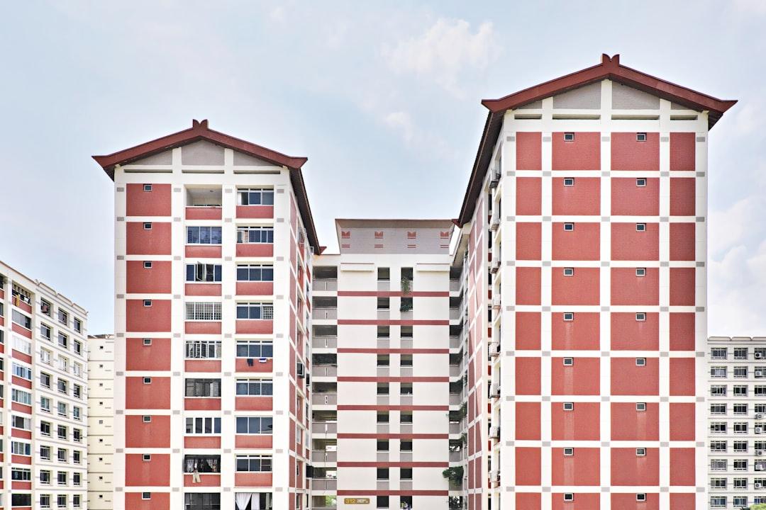 a large red and white building with two stories